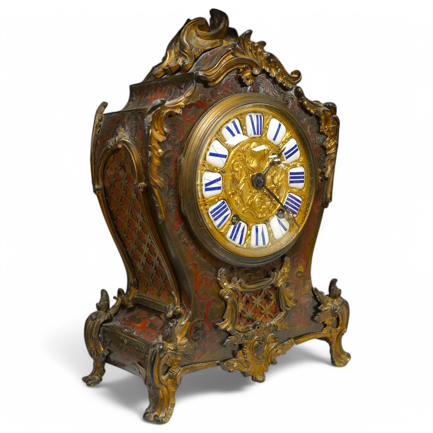 A 19th century Boulle work mantel clock with enamelled Roman numerals, with pendulum and key, 34cm high. Condition - fair, untested